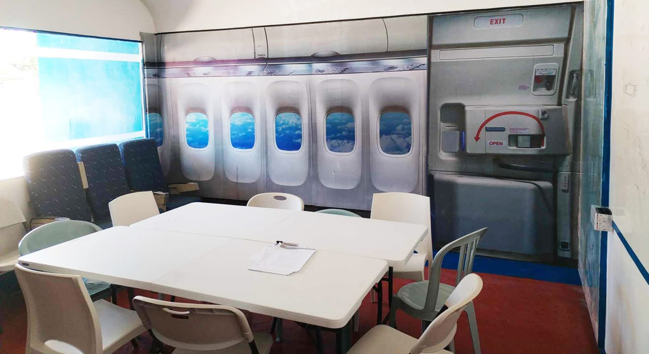 Aviation briefing room with cabin training wall