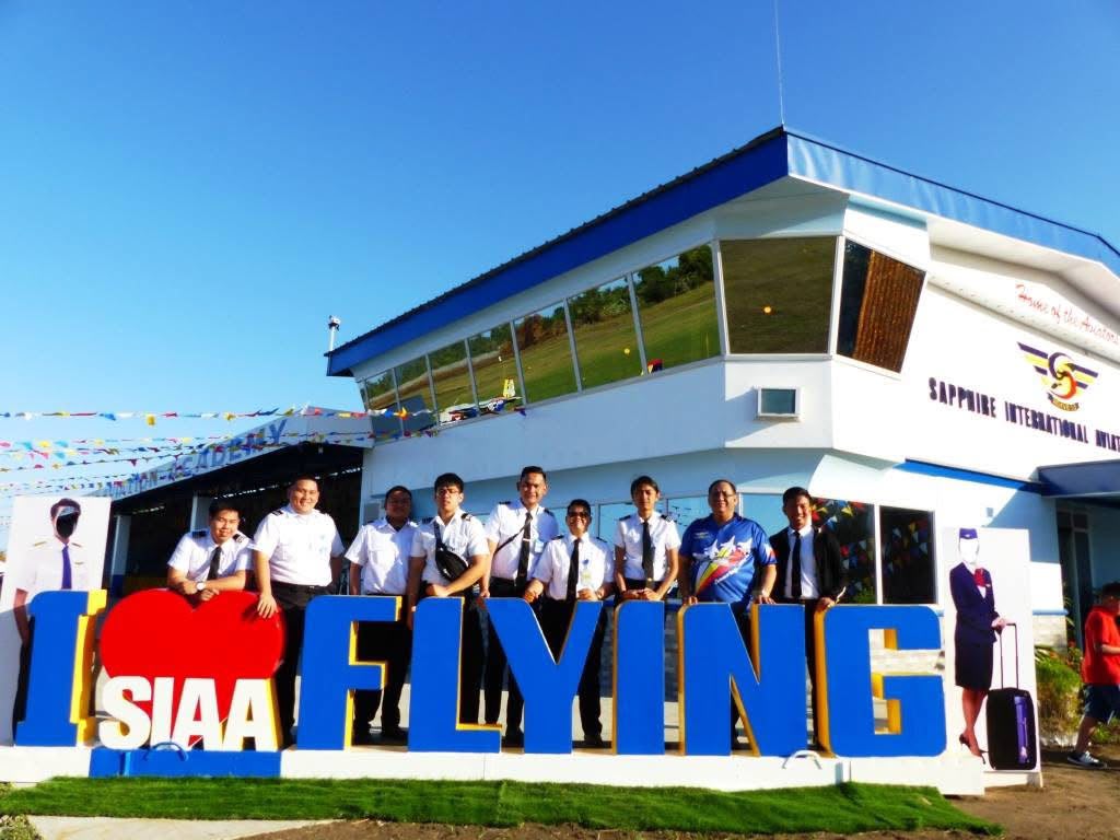 SIAA students standing outside the aviation academy campus